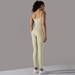 Detail view of the ribbed fabric and low back cut of the mint green seamless unitard