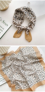 Detail of floral cotton linen square scarf with yellow borders and delicate print