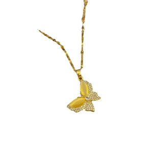 Golden butterfly necklace with yellow oval crystal and pave diamonds on white background