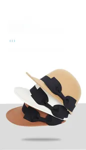 Detail of vintage wool felt hats with elegant black grosgrain bows in multiple colors