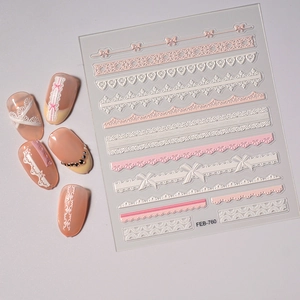 Detailed macro view of 5D white lace and bow embossed nail art stickers FEB-760