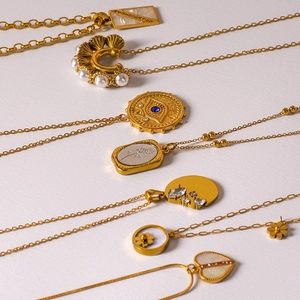Vintage gold heart and geometric necklaces with zircons and mother of pearl pendants