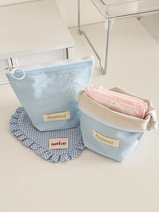 Sky blue minimalist fabric storage pouch set with white zipper and circular pull ring