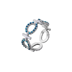 Detail of adjustable silver ring featuring blue stone inlay and white star moon patterns