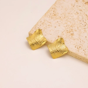 Minimalist gold square stud earrings with irregular crushed metal texture and geometric design