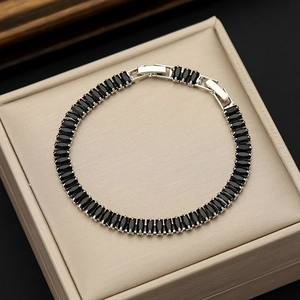 Fashion tennis bracelet with 2.5x5mm black zircon stones in a silver setting for men and women