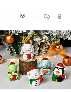 Detailed close-up of cute resin Christmas animal figurines featuring festive holiday hats