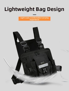 Detail of a lightweight black tactical vest bag with reflective strips and durable nylon
