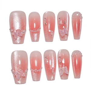 Press-on nail set featuring pink gradient cat-eye finish with 3D butterfly and pearl accents