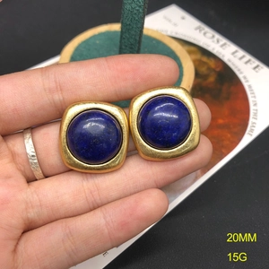 Detailed close-up of blue lapis lazuli earrings with gold frame, 20mm size and 15g weight