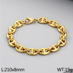 Macro shot of 8mm gold anchor link bracelet showing 210mm length and polished metal texture