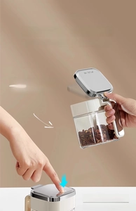 Detail view of moisture-proof spice jar showing one-hand push button and sealed lid mechanism