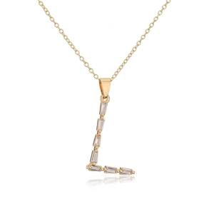 Macro detail of 18K gold plated letter L pendant with rectangle cubic zirconia stone