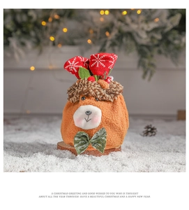 Brown teddy bear plush Christmas gift bag with knit snowflake trim and green glitter bow