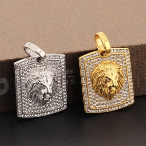 Detail of hip hop lion head pendants in gold and silver finish with crystal pavé stones