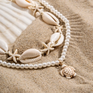 Handmade shell and starfish necklace with white pearl chain and golden turtle pendant