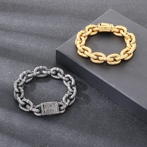 Macro detail of heavy duty titanium steel curb chain bracelet with hammered texture finish