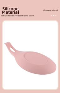 Pink silicone utensil rest featuring heat resistance up to 230°C for kitchen cooking