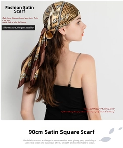 Detail view of smooth satin paisley headscarf with brown and gold geometric patterns