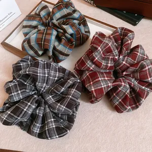 Three-piece set of plaid scrunchies in blue, red, and black classic Scottish patterns