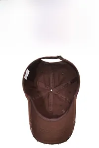 Detail view of distressed cotton baseball cap showing internal 6-panel structure and stitching