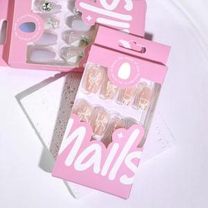 Short ballet press-on nails with 3D bows, pearls, and cat-eye floral designs in pink box