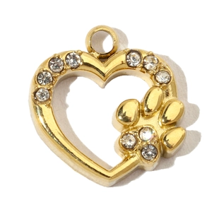 Macro shot of a gold heart pendant with clear zircons and a small paw print design