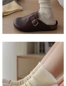 Close-up of brown leather clogs with metal buckles and cream ribbed knit mid-calf socks
