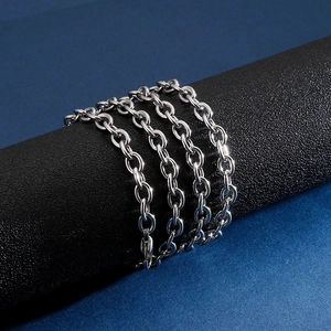Polished silver stainless steel O-link chain necklace for men shown on a black display
