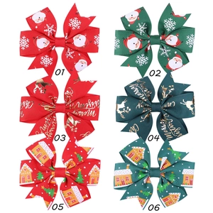 Detailed set of 6 Christmas hair bows with Santa and reindeer prints on ribbed fabric