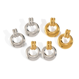 Detailed shot of geometric circle earrings in gold, silver, and dual-tone metal finishes