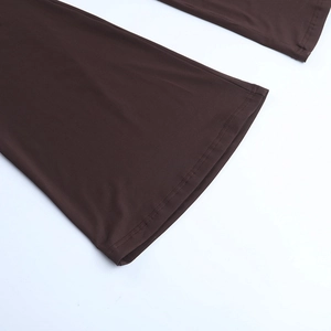 Detail of dark brown flare pant hem with high-quality double-needle reinforced stitching