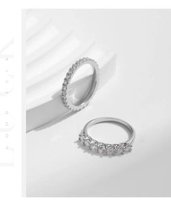 Macro detail of stacked S925 sterling silver rings with brilliant moissanite pave setting