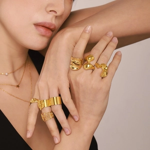 Layered 18K gold-plated necklaces with pearls and a variety of stylish rings set