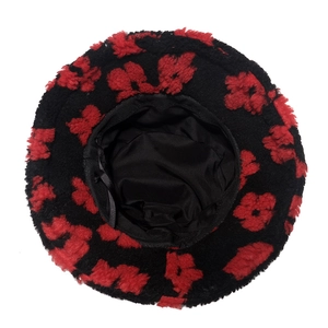 Detail of floral bucket hat featuring black inner lining and adjustable drawstring