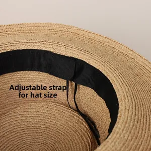 Detail of internal sweatband and adjustable drawstring inside the raffia sun hat