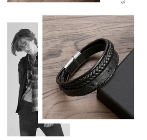 Detailed view of men's double-layer leather bracelet with braided cord and silver magnetic clasp