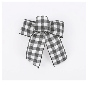 Close-up of black and white checkered ribbon bow for Christmas tree decoration