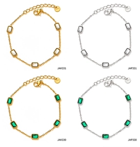 Detailed set of stainless steel zircon bracelets in gold and silver with emerald stones