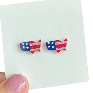 Detail shot of United States map stud earrings with red white blue glitter finish