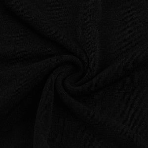 Close-up of black textile fabric showing fine knit texture and soft material draping