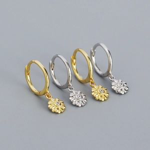 Detailed view of 925 sterling silver flower pendant earrings in gold and silver finishes
