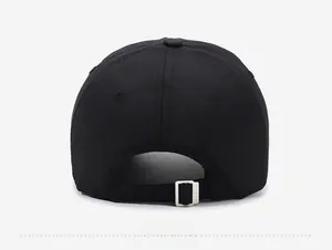 Detail view of the black baseball cap rear with an adjustable silver metal slider buckle