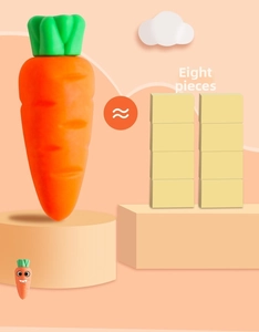 Detail view of jumbo carrot eraser showing size comparison with eight yellow blocks