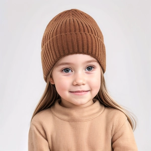 Close-up of knit baby hat featuring dark brown ribbed texture and thick soft yarn