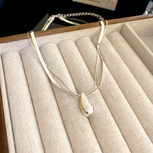 Silver double-layer water drop necklace featuring a flat snake chain and glossy finish