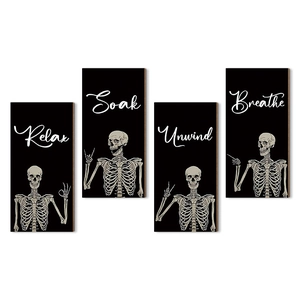 Gothic 4-piece wooden skull wall plaques featuring Relax Soak Unwind and Breathe text