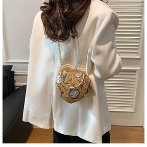 Golden heart-shaped sequin clutch bag with floral beadwork and metal chain strap
