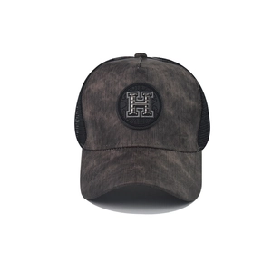 Retro washed grey trucker hat with metal H logo and breathable black mesh back