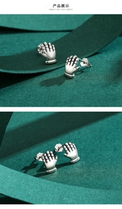 Detailed close-up showing the S925 sterling silver hallmark on the palm stud earrings